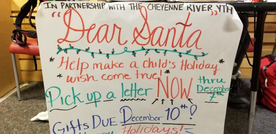 The+sign+for+the+Dear+Santa+fundraiser.+Students+and+staff+donate+gifts+to+children+who+cannot+afford+their+own.