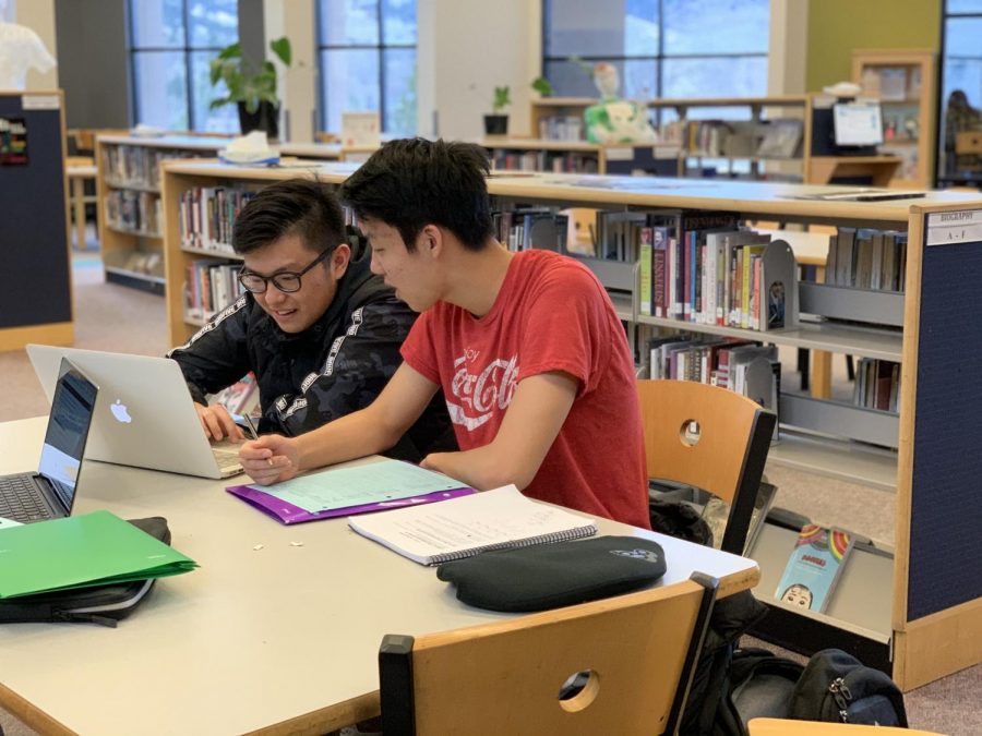 Kevin Xu and Jaden Kwon studying in the library. Students are hard pressed to achieve highly in academics across the school.