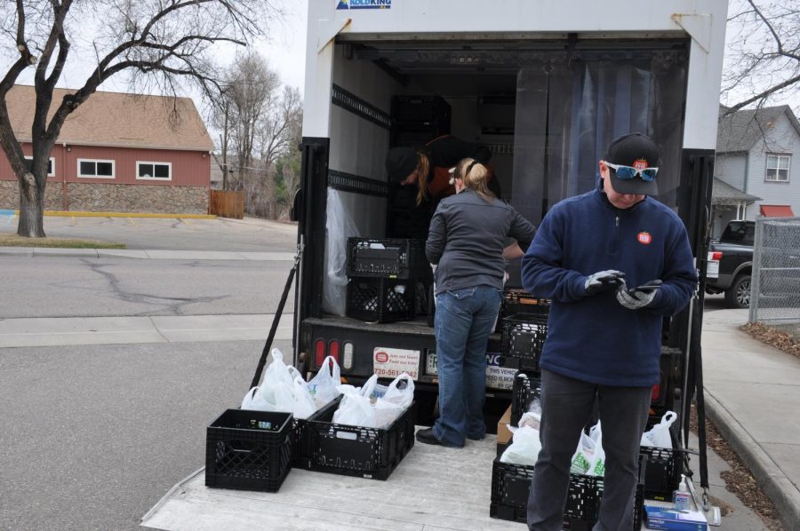 The distribution truck at Louisville Middle School, loaded with bags of food.