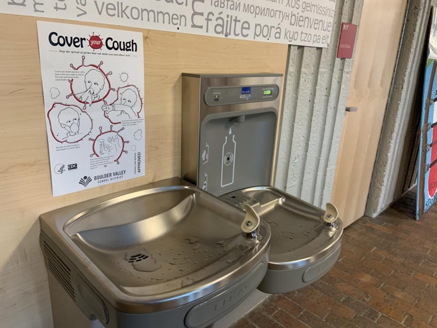 Water fountains are now decorated with more signs encouraging basic hygiene. This one shows how to cover a cough.