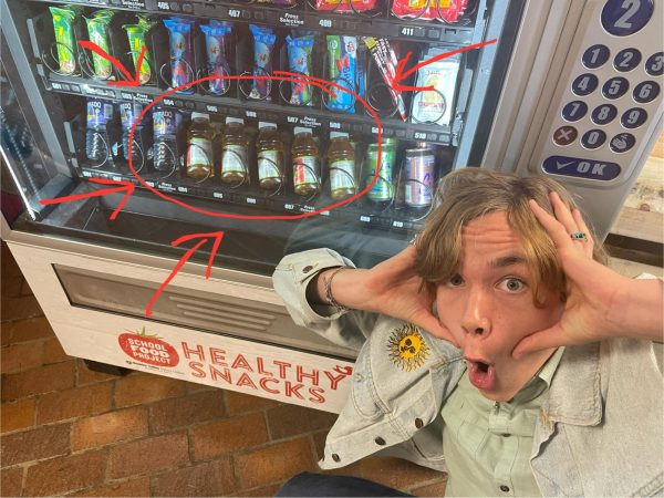 alec deforest posing with the new apple juice. photo by sitara patel